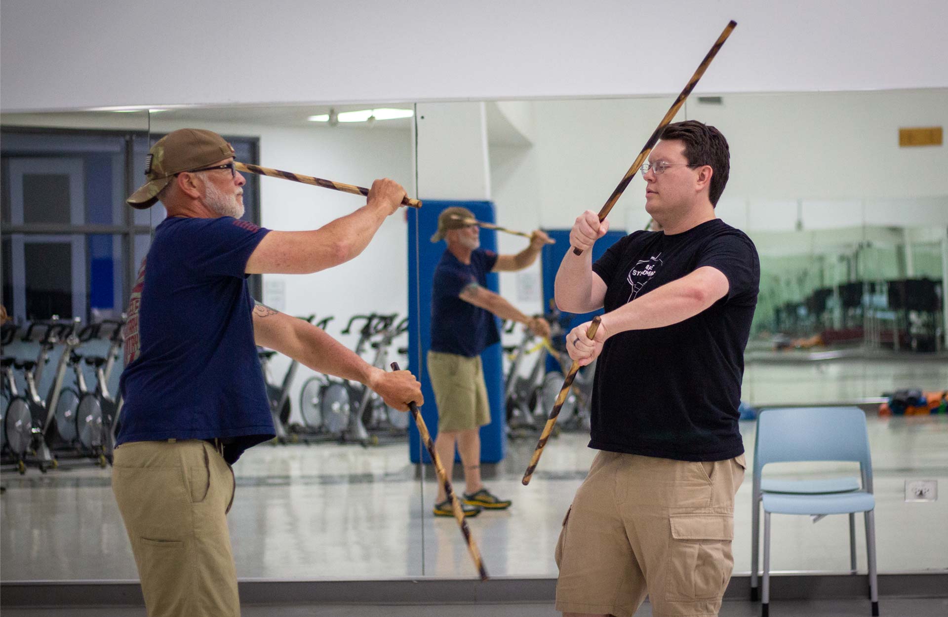 Two white males in Modern Arnis class Two white males in Modern Arnis class